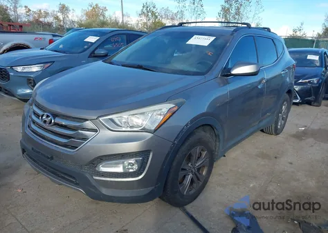 2015 Hyundai Santa Fe Sport 2.4L z USA, uszkodzony, nr VIN 5XYZUDLB9FG238562